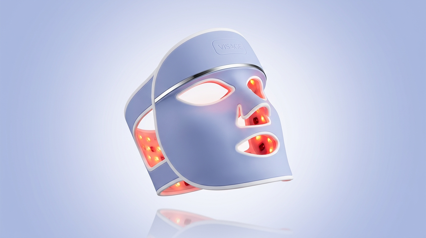 The Visage LED Mask — a periwinkle skin-safe silicone face mask glowing with red and near-infrared light therapy LEDs